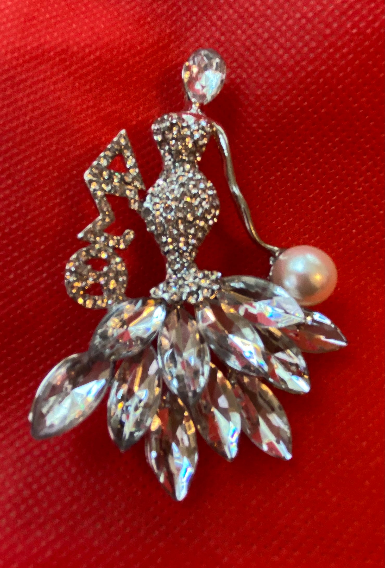 A Delta Crystal Lady Brooch in Silver