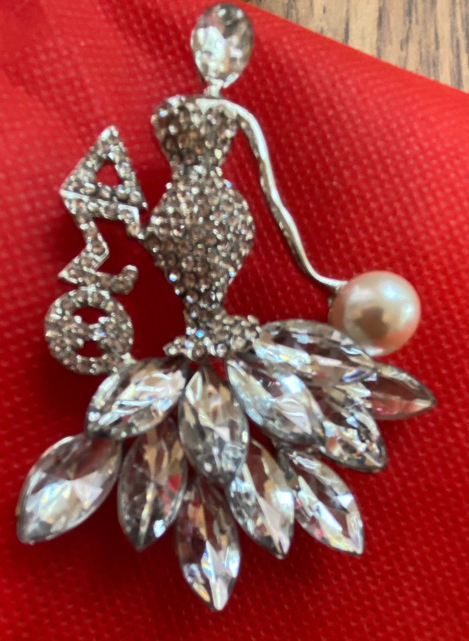 A Delta Crystal Lady Brooch in Silver