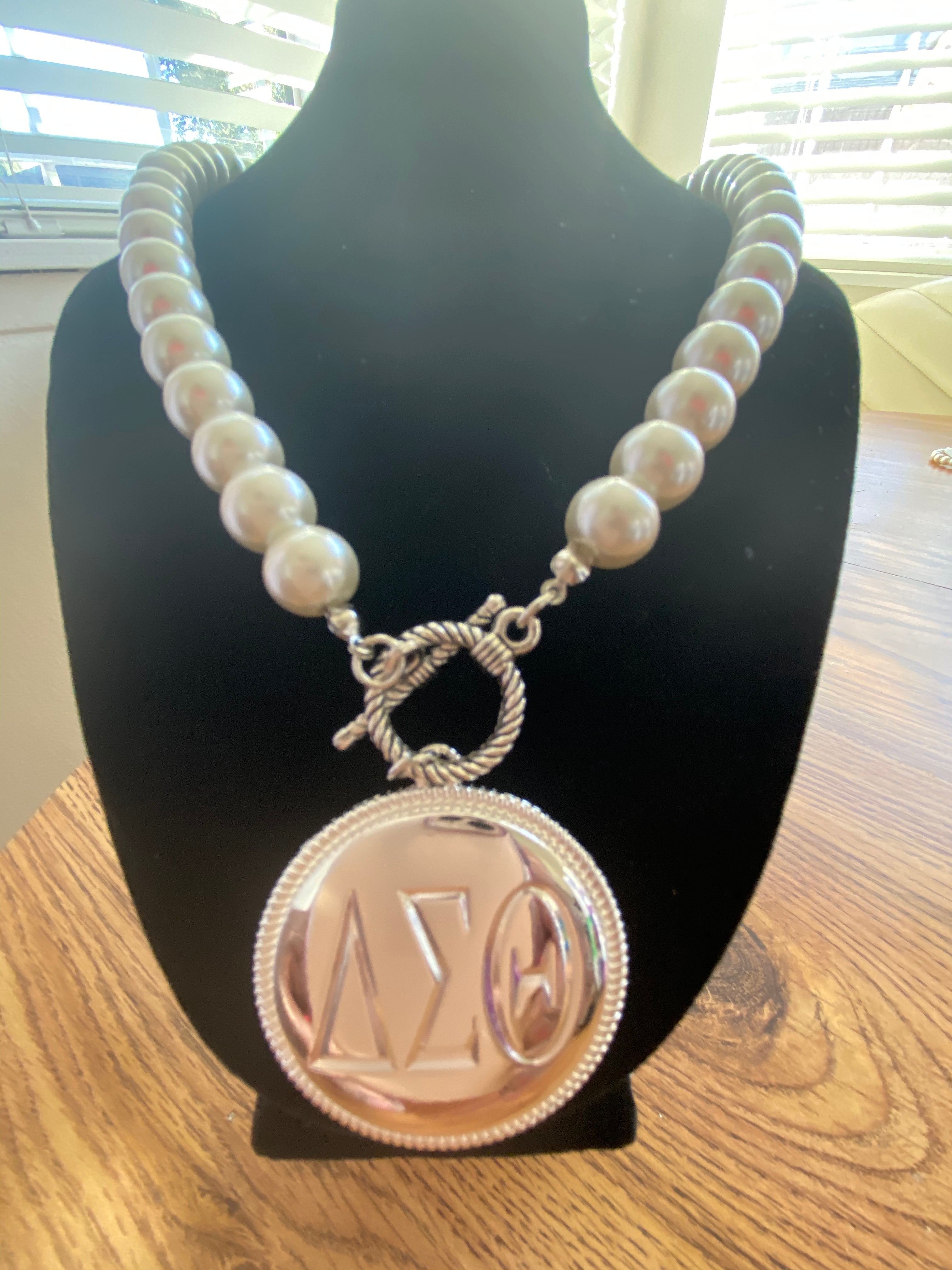 A Beautiful Delta logo attached to Pearls